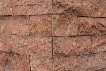 Angle of inclination of the red-brick walls.