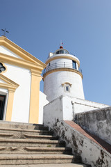 Fototapeta na wymiar Lighthouse in Fort Guia - Macau. A historic fort located in the former Portuguese Colony of Macau