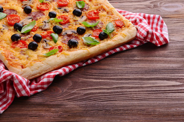 Delicious homemade pizza on table close-up