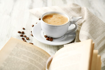 Still life with cup of coffee and book, close up