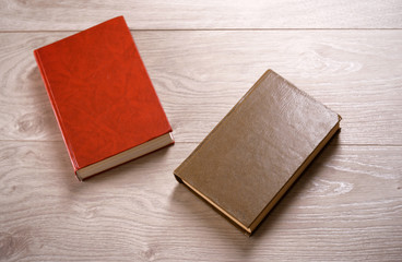 Old books on wooden background