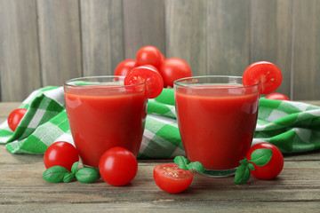 Glasses of tomato juice with vegetables on table close up