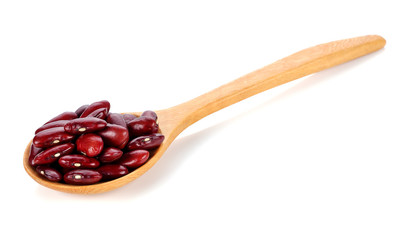 Red kidney beans on a wooden spoon isolate on white