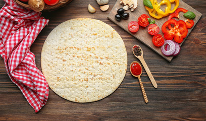 Ingredients for cooking pizza on wooden table, top view