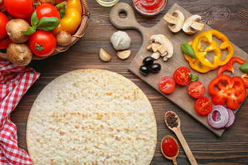 Ingredients for cooking pizza on wooden table, top view