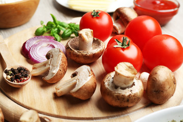 Ingredients for cooking pizza on wooden table, closeup