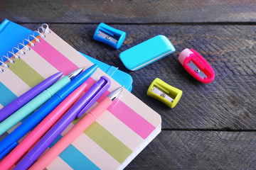 Colorful stationery on wooden table, closeup