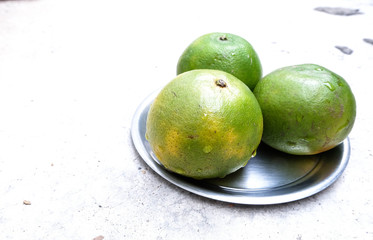 sweet green Thai orange on dish