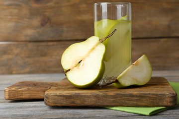 Pear juice with fresh fruits on wooden background © Africa Studio