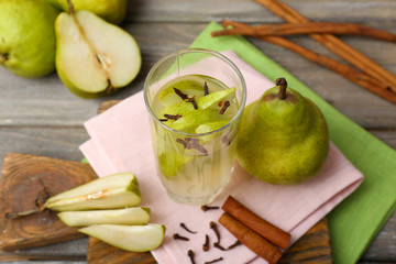 Pear juice with fresh fruits on table close up