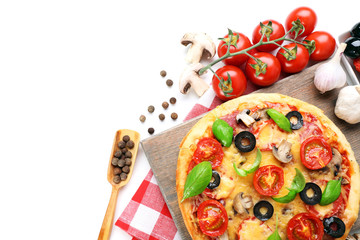 Tasty pizza with vegetables and basil on cutting board isolated on white