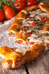 Sliced pie Turkish pide close up and ingredients. vertical
