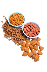 Blue ceramic dogs bowl. Dry dog food in bowl isolated on white background