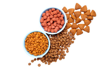 Blue ceramic dogs bowl. Dry dog food in bowl isolated on white background.