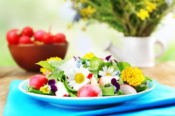 Light organic salad with flowers, close up