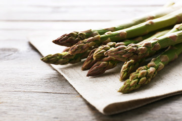 Fresh asparagus on wooden table, closeup