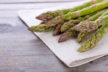 Fresh asparagus on wooden table, closeup