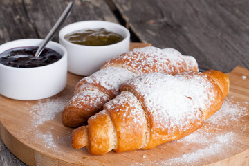 fresh croissants with jam for breakfast