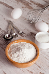 ingredients and tools to make a cake, flour, sugar,eggs