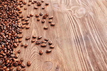 Coffee beans on wooden background