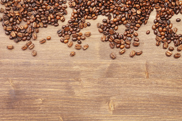 Coffee beans on wooden background