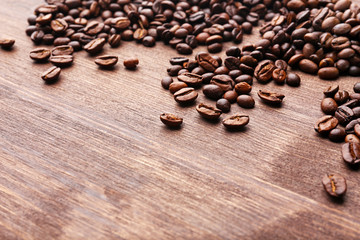 Coffee beans on wooden background