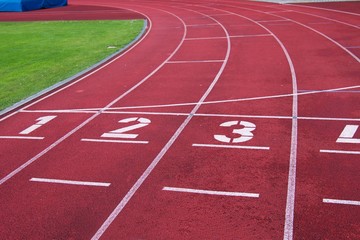 Red running racetrack on the athletic stadium