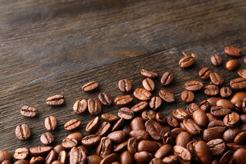 Coffee beans on wooden background