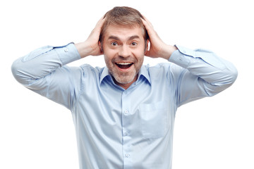 Fototapeta premium Smiling male holding his head.