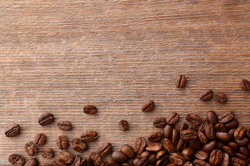 Coffee beans on wooden background