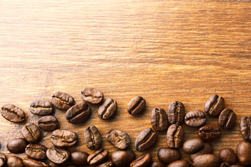 Coffee beans on wooden background
