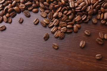 Coffee beans on wooden background