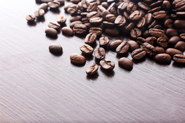 Coffee beans on wooden background