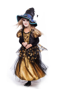 Adorable little blond girl wearing a witch costume. Halloween. Fairy