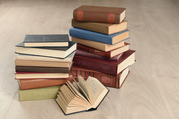 Heap of old books on wooden background
