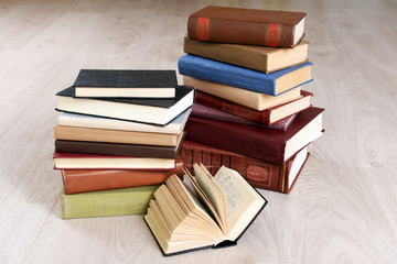 Heap of old books on wooden background