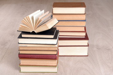 Heap of old books on wooden background