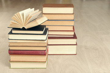 Heap of old books on wooden background