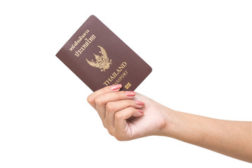 Hand holding passport isolated.