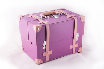 Purple suitcase isolated on white background.