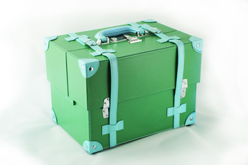 Green suitcase isolated on white background.
