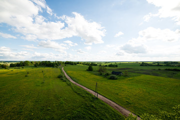 Fototapeta na wymiar beautiful green fields under blue sky in summer