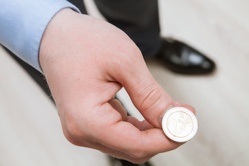 Businessman tossing a coin