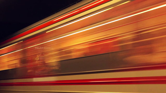 Subway Train with Passengers Arriving to Underground Metro Station, Motion Blur