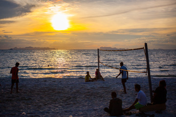 Fototapeta premium Volleyball game at Koh Samui Pier in amazing sunset, Thailand