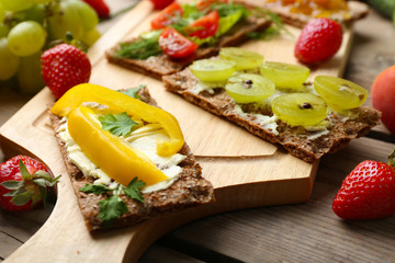 Still life with vegetarian sandwiches on wooden table