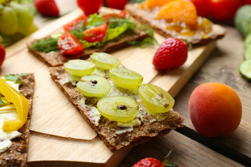 Still life with vegetarian sandwiches on wooden table