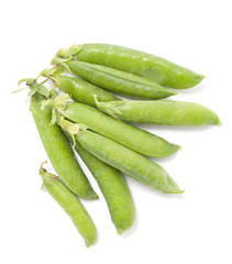 Several pods of green peas on a white background