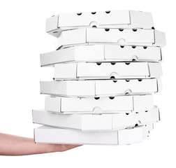 Hand holding pizza boxes isolated on white