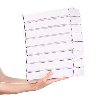 Hands holding pizza boxes isolated on white